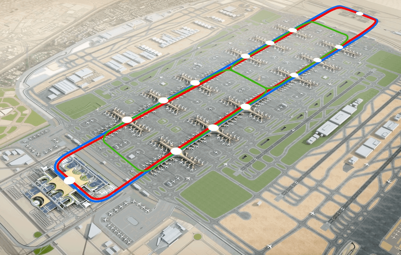 Aerial visualisation of the DWC concourses and terminal, with the tracks for the Automated People Mover highlighted Aerial visualisation of the DWC concourses and terminal, with the tracks for the Automated People Mover highlighted